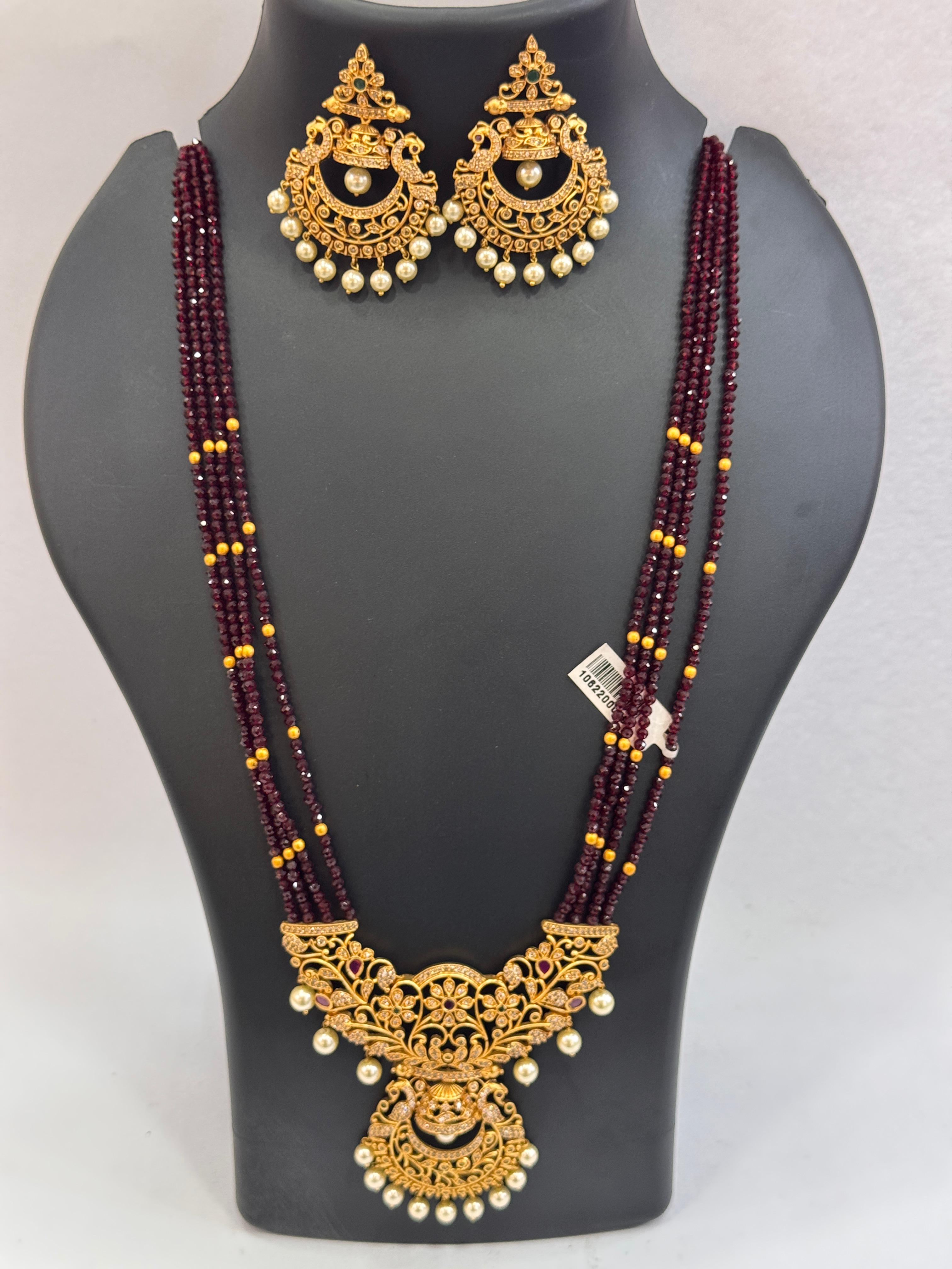 MULTI LAYERED LONG HARAM WITH MAROON AND WHITE PEARL WITH EARRINGS